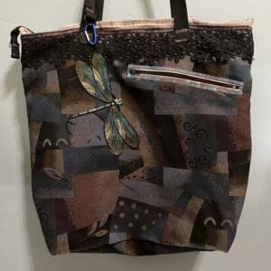 Dark abstract patchwork tote bag with dragonfly.