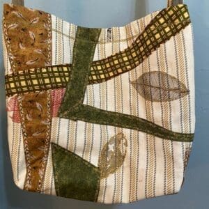 A bag with strips and leaves on it