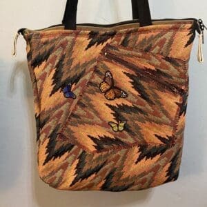 A bag with leaves and butterflies on it