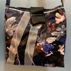A bag with flowers and stripes on it