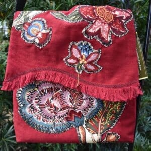 A red bag with flowers on it