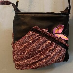 A purse with a butterfly on it