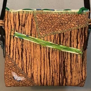 A bag with a picture of trees on it.