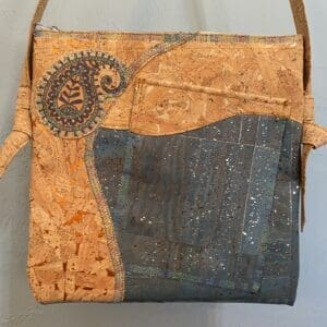 Cork handbag with paisley and blue accents.